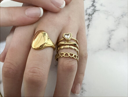 Charmin&#039;s Gold-Colored Ring with Subtle Filled Hearts Steel R1650 &ndash; Modern Love