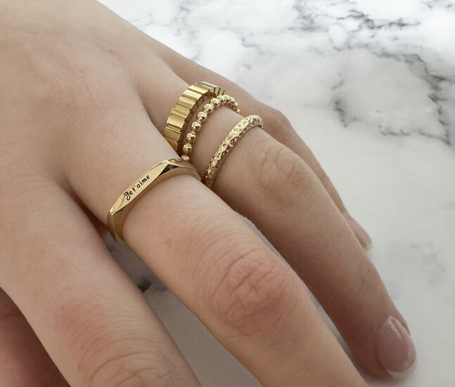 Charmin's Gold-Colored Ring with Cut Rectangles and Matte Details R1546 – Modern and Architectural